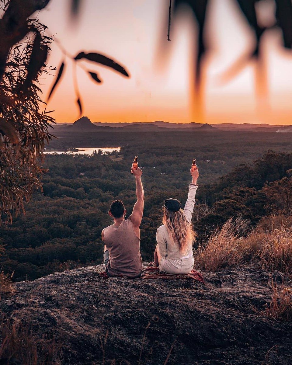 noosa's tweet photo. Hands up if you're dreaming of #Noosa sunsets like this one with IG/kobajourney 🙋♀️ #EntertheBiosphere for golden moments clinkin' @headsofnoosa bevvies at the tippy top of #MtTinbeerwah ✨ Talk about mid-week #goals! 😜 #Noosa https://t.co/EVLN8Avnbs