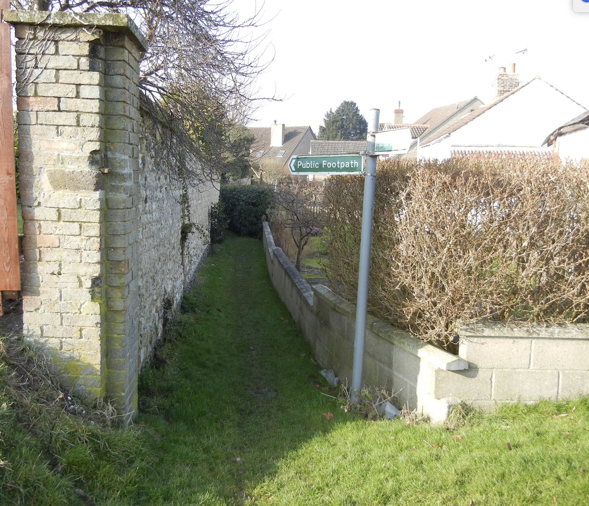 10. The next puzzle was revealed when I turned around, with my back to the public footpath sign. The footpath along the back of the houses continued eastwards across the road (Church Lane), running just to the L of the hedge. Why did follow a ditch when ..