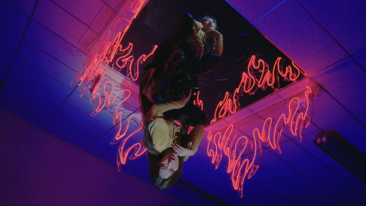 Choerry appears to be “upside-down” same as her representative animal, a bat, the same way she was resting on a tree in ‘Love Cherry Motion’ MV. We can also see her reflection the same way she’s always had a doppleganger (*cough* Hyunjin)