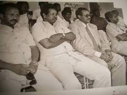 Bursting with joy,  #Eritrea|ns watched in awe as the entire leadership of EPLF & ELF make their way to the centre hugging, smiling & dancing. Except one: Isaias Afewerki. Saeed Saleh (ELF) & Romadan Nur are seen begging him to join - even pulling him - as he refused.