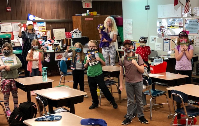 Ms. Smith, Library Media Coordinator at Glen Arden Elementary, paid a visit to Ms. Nutt's classroom with library mascot Penelope (a purple marionette bird - wearing her mask of course!). The students were thrilled when the teacher handed out their library books! <a href="/BuncombeSchools/">Buncombe Schools</a>