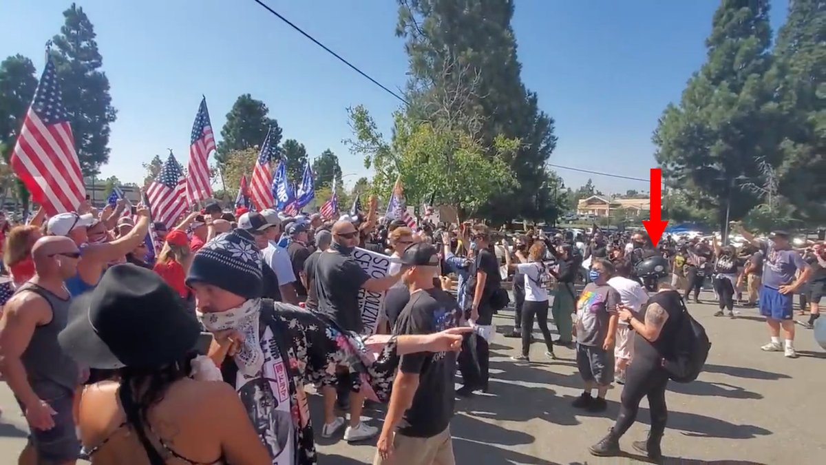 We fast forward.By the time the camera pulls out, Cast Lady (left) has already initiated a confrontation with Target.Backup tried to take her out of the situation.Target doesn't fall into the trap.Helmet Lady is calmly texting to the others.