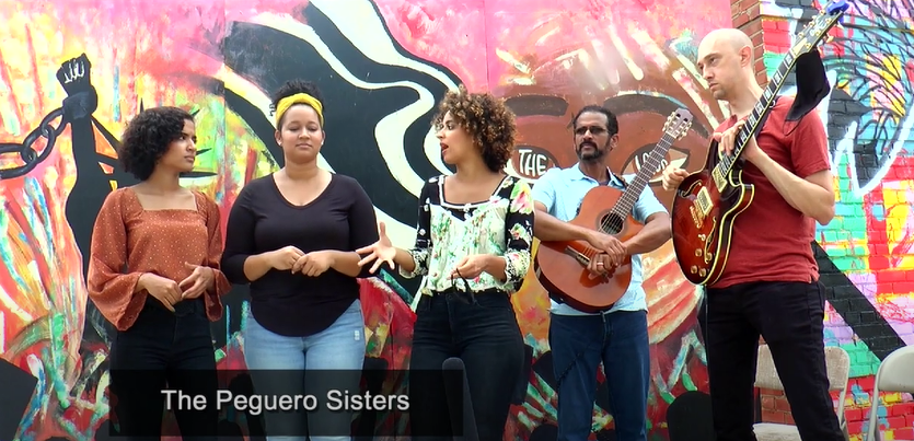 The PEGASIS Band sings “Lean On Me” with our Creative Crew’s “The Look” mural as the back drop. Peguero Sisters, lends their musical talents as part of the LEAN ON ME social justice initiative to empower youth voice! buff.ly/3lKv84U