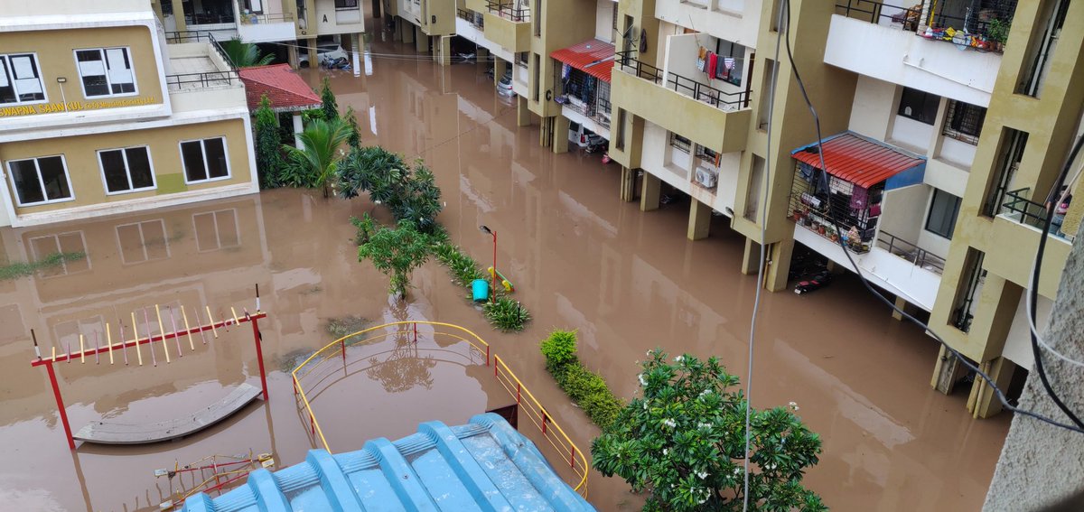 acronis2286's tweet photo. @PMCPune @suniltingre Please help. Swapna Saankul Society Porwal Road under 2ft water. All cars drowned. Society gate broken. https://t.co/mGzjsdWs6b