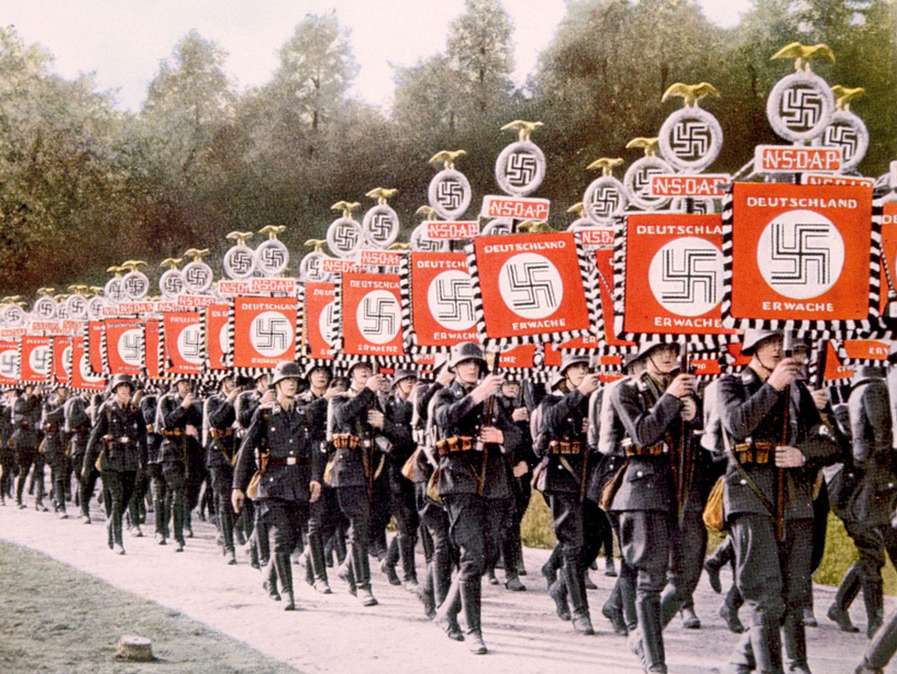 Fascists embrace pageantry; costumes; symbolism; and flags and banners with elemental colors such as red, white and black.