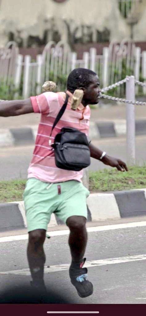 BigMan_Xander's tweet photo. The name one of the thugs that disrupted #AlausaProtest is Adagun Osha from Agege. One of the protesters took his picture! Also i got the no of Baba Alado who sent the thugs 0803323936, 08077071692. RT THIS AGGRESSIVELY.  They can't mess with us and go free #EndSWAT https://t.co/qXJewcp8AS