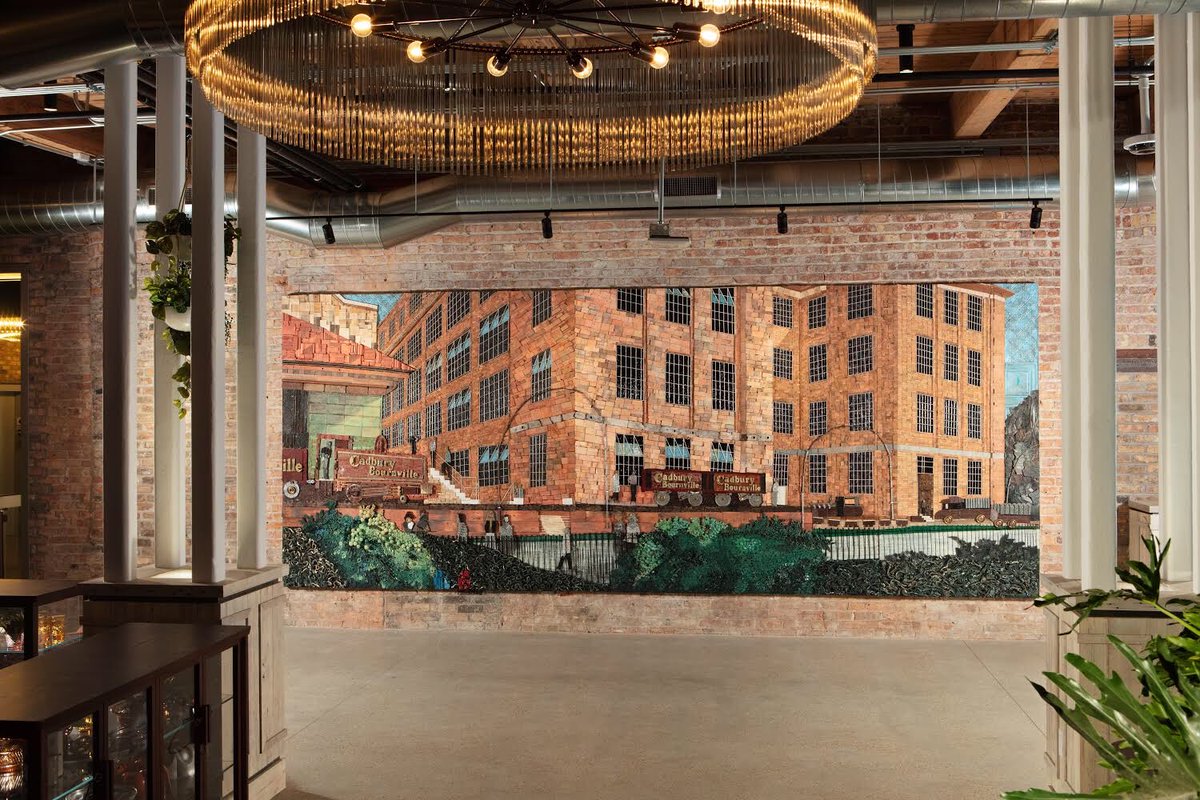 JohallaProjects's tweet photo. All Kinds Studio paid homage to @MDLZ’s chocolate legacy by creating a mural of Bournville, the home of Cadbury chocolate, out of reclaimed objects found throughout Fulton Market. Muralist Simone Rawski painted a decadent display of towering baked goods and treats. https://t.co/9JG6fPJfLp