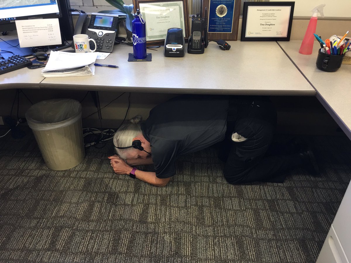 SBCountyCode's tweet photo. Shake Out is happening now! See how our Office Assistant Precious & Code Enforcement Officer Doughton dropped, covered, and are holding on! #sbcshakeout #sbsafe #vision4safety https://t.co/WjhuBLcnhz