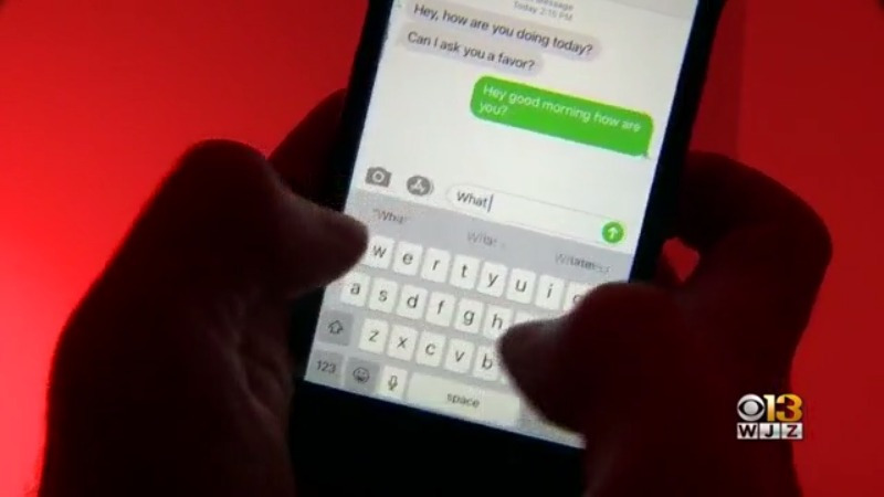 Fingers typing on cell phone