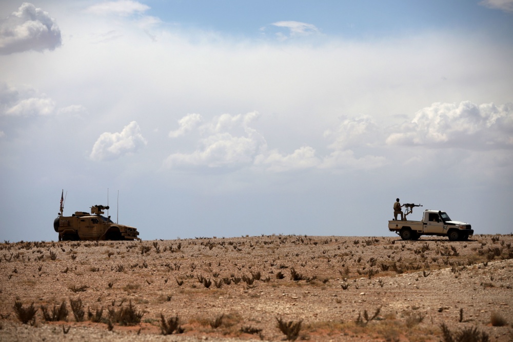 OIRSpox's tweet photo. A key part of the mission to #DefeatDaesh falls on the @Coalition members and our partners in the At Tanf Garrison. Protection of this terrain keeps Daesh &amp; other outlaw groups from using this region. CJTF-OIR is committed to maintaining the security in &amp; around At Tanf Garrison. https://t.co/E4J4lMIOAb
