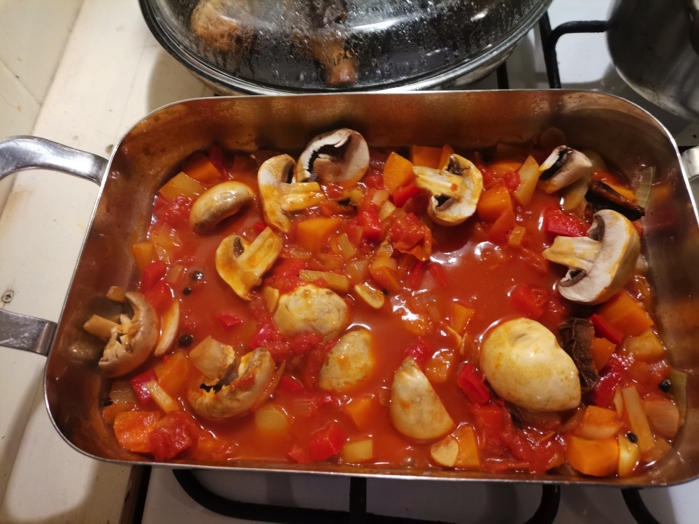 Then slice your mushrooms in half and add it to the tomato mixture. let it simmer for only a minute or two.