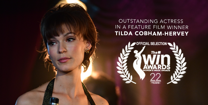 IAmWomanMovie's tweet photo. Congratulations #TildaCobhamHervey, winner of Outstanding Actress in a Feature Film for her incredible performance as Helen Reddy in #IAmWomanMovie at @TheWINAwards Awards 2020! ✨👏 https://t.co/u9ZHhxEEXq
