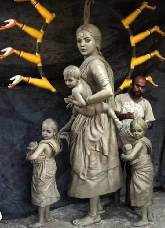 Pallab Bhowmick's  Ma Durga  for the Pujo  this year, as a migrant worker with her children. 
Very evocative.