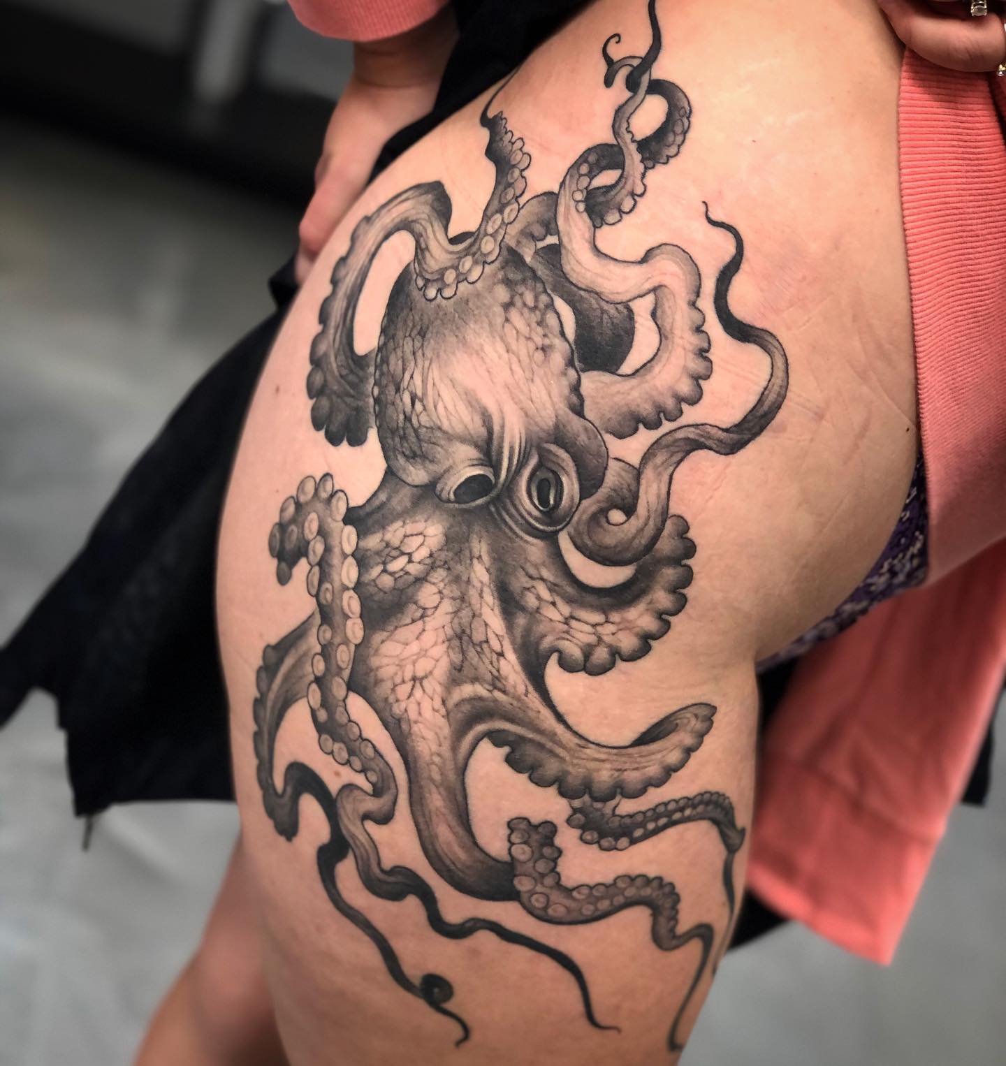 Sketch work style octopus tattoo on the right thigh