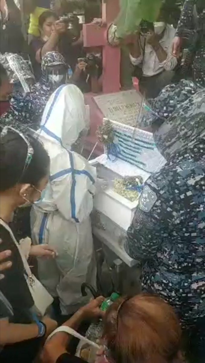 LOOK: Nasino, again wearing a full set of PPE and in handcuffs, grieves at her daughter River's final resting place at Manila North Cemetery. Counsels and kin pleading with police to uncuff her.  |  @MBMinkaTiangco