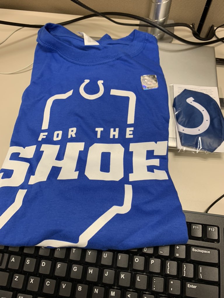 To my Twitter followers: The Colts were handing out free stuff at Monument Circle this morning so I stopped before work. Little did I know the shirt and mask is what they gave away before the Jets game. I already have these so I’m doing my very first Twitter giveaway: