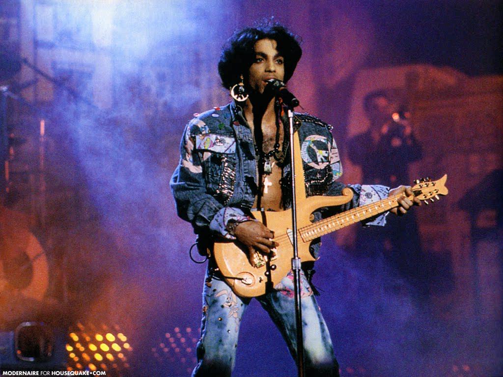 Okay Prince’s all denim look - undoubtedly one of his most iconic fashion moments. The boho-hippy, purple dreamer look pairs well w/ the social commentary of  #SOTT. The DIY denim jacket a symbol of the every man but also the dreamer thanks to the offbeat customisation.