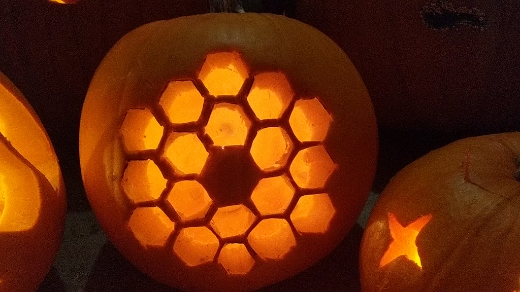 Pumpkin with a carved Webb primary mirror design, designated as "Level 2" of carving difficulty out of Webb's 3 pumpkin stencils