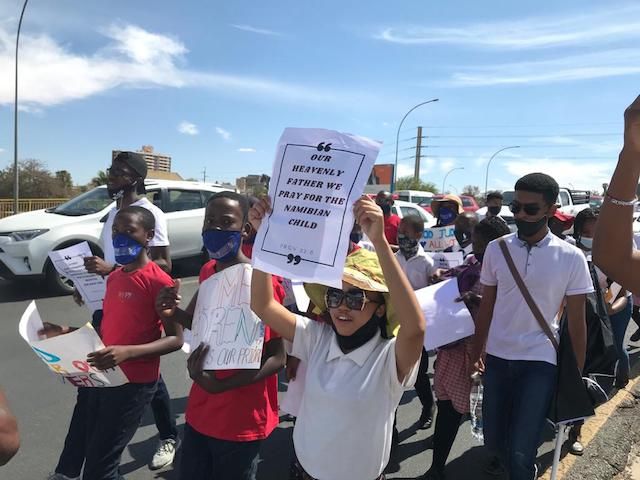 TheNamibian's tweet photo. At least 50 students walked through the Windhoek CBD on Friday, praying and chanting about the need to keep the nation in their prayers and turn away from wickedness such as gender-based violence and rape, which have become rampant in the country. Photos: Lazarus Amukeshe https://t.co/QOLyuzb1ON