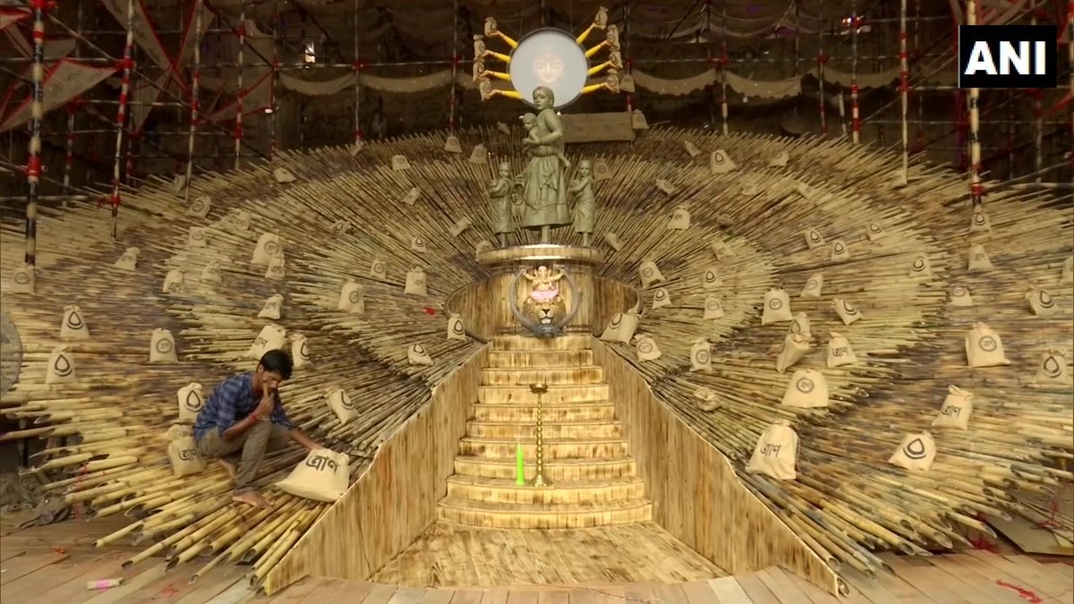 ANI's tweet photo. West Bengal: Kolkata Puja pandal replaces traditional Durga idol with woman carrying a child

"The idea came during lock-down when I saw the plight of migrant workers. A woman walking from such afar sans aid with 4 children is something I consider worth deifying," says the artist https://t.co/UVrve59UQ4