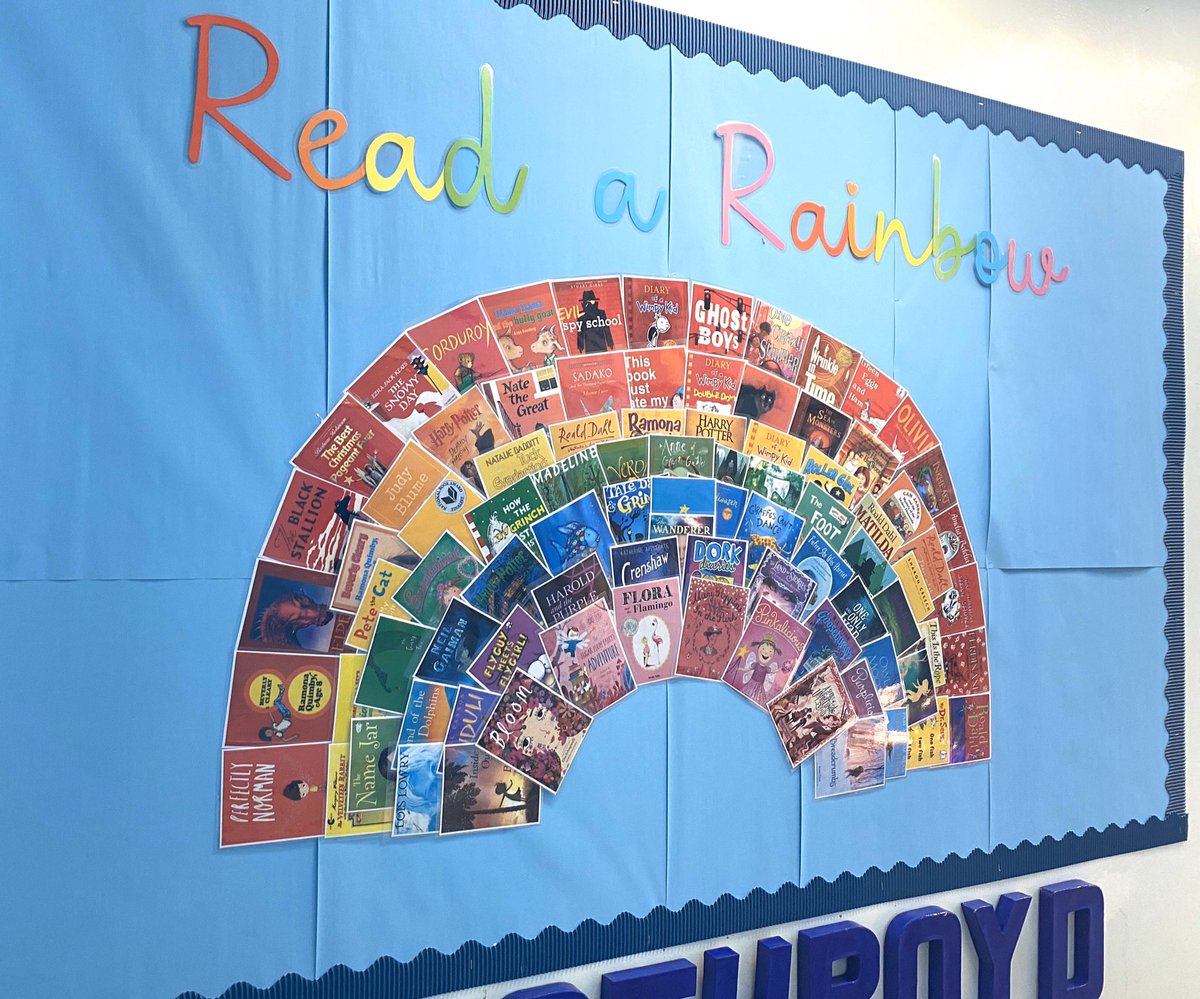 Love our new reading display made by my acting deputy- a rainbow of book covers! #readtoachieve