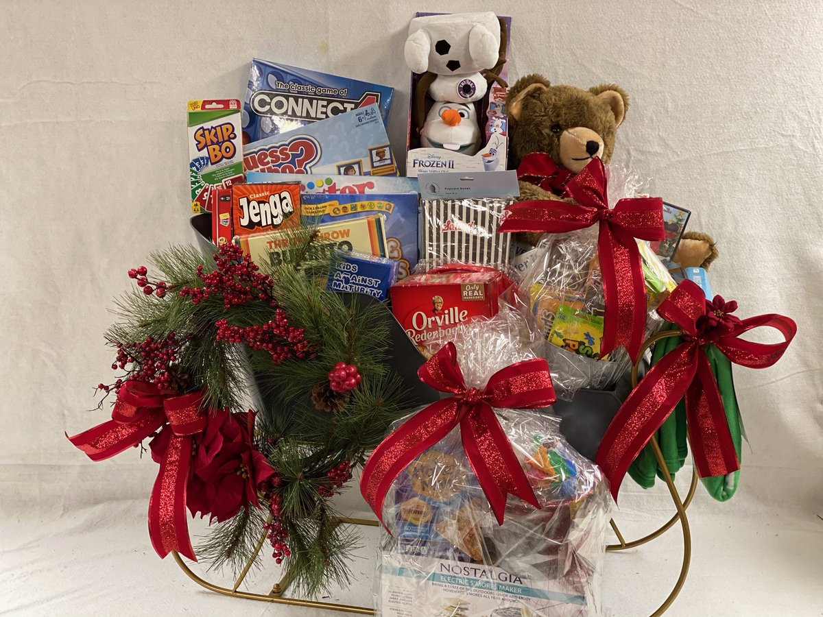 SeattleFOT's tweet photo. This holiday sleigh is loaded with goodies for a fun family night at home—movies, games, a popcorn machine, and more! It's one of the items included in the live auction during our virtual gala November 21 benefitting @seattlechildren – learn more: https://t.co/GKXh6yfr25 https://t.co/3LfXNWPbtB