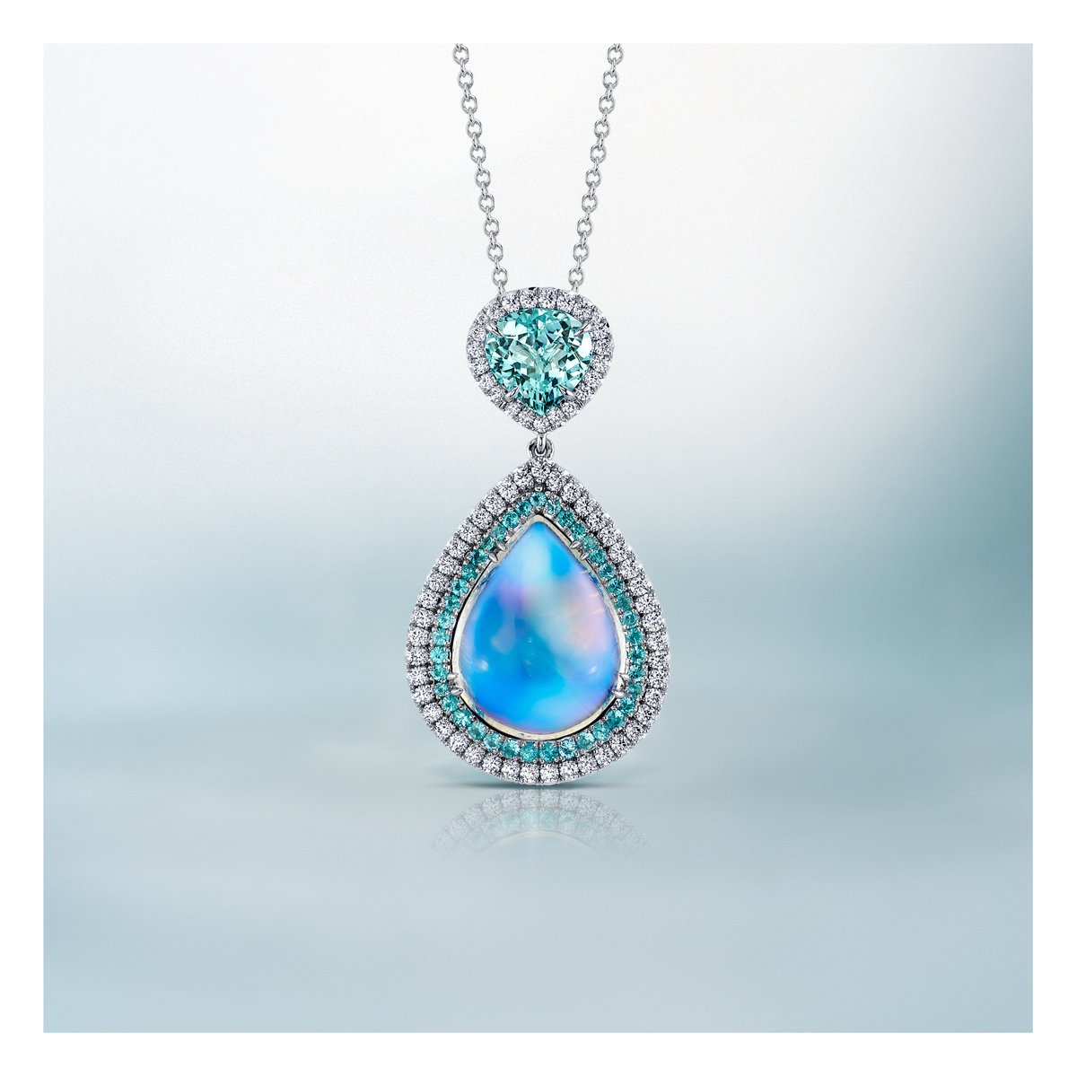 ⁠Paraíba-type tourmaline + moonstone = a wonderland of bright, whimsical blue. Tag someone in the comments below who would love this pendant in honor of October! ✨⁠
⁠
P1468⁠
