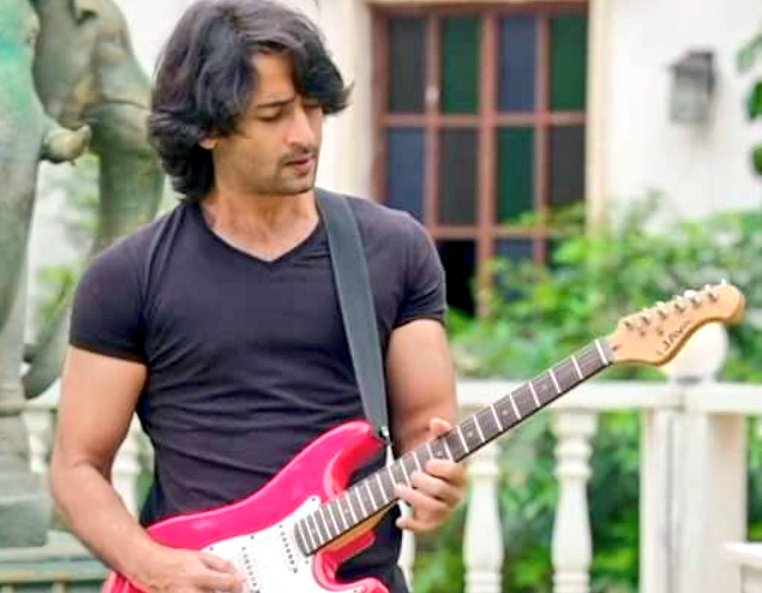 II Stylish AbirThe Rockstar AbirThose bouncy hairs black half sleeved tshirt made Abir look too hot to handle with an electric guitar in his strong arms making him resemble a real rockstaa that he actually is  #EvergreenShaheerAsAbir