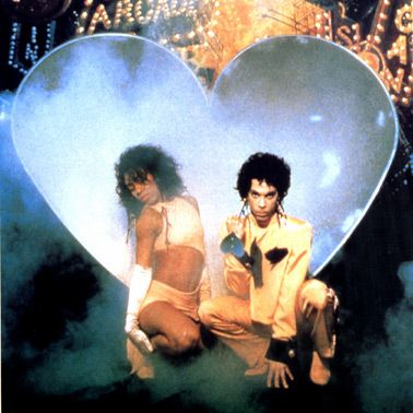 Following the Parade era, Prince began to retire more ornate fabrics in favour of clean graphic prints & silhouettes. He started to wear graphic symbols such as hearts, peace signs & crosses.  #SOTT artwork, sets, accessorises communicated uplifting messages of love & salvation.