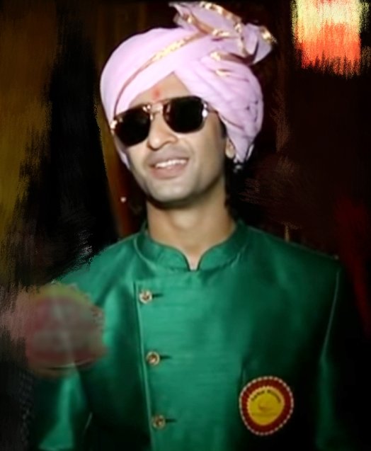 Stylish AbirThe Marathi lookIt was Ganapati n Gujrati chokro Abir Rajvansh was decked up as Marathi in Mumbai The bluish green sherwani pink pagri n making him look hotter was d black shades Definitely our clean shaved Munda looked too dashing  #EvergreenShaheerAsAbir