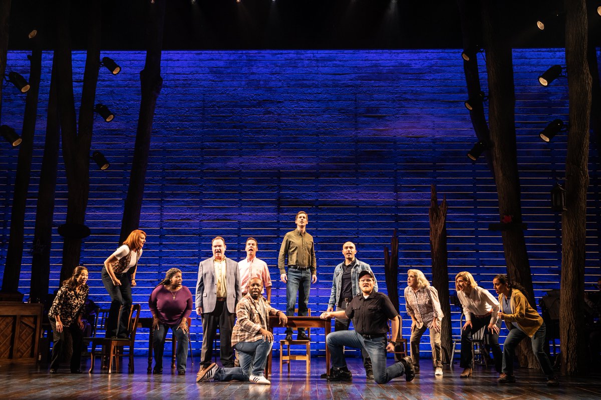 Production photo of our North American Tour cast on stage