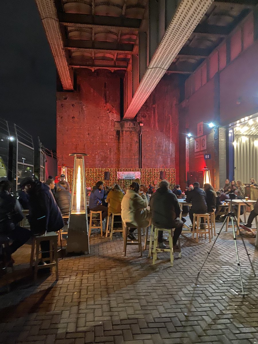 Halcruttenden's tweet photo. An outdoor gig, under a bridge, in Manchester. They’re aiming to run right through the winter. #onlyinthenorth https://t.co/YyM0kpiLZA