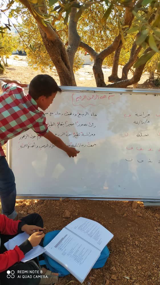 This is what school looks like for many children in Idlib, northwest #Syria . Outside, under the olive trees... @UNICEF and others are supporting many of these mobile teachers, but it’s not enough. Idlib needs more schools and more rehabilitation of damaged schools