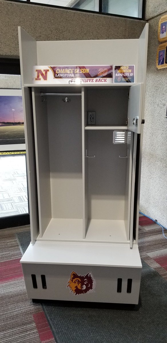 moonjosh's tweet photo. Prototype is in the building! Missing a few pieces, but you get the picture. Vents in 3 different sections, helmet on top, pads on right, clean finish all the way around. Player and donor plates mounted on soffit up top. 30 left to sell, let's go @NSUWolves_FB alumni! https://t.co/kdDSL4X3cn