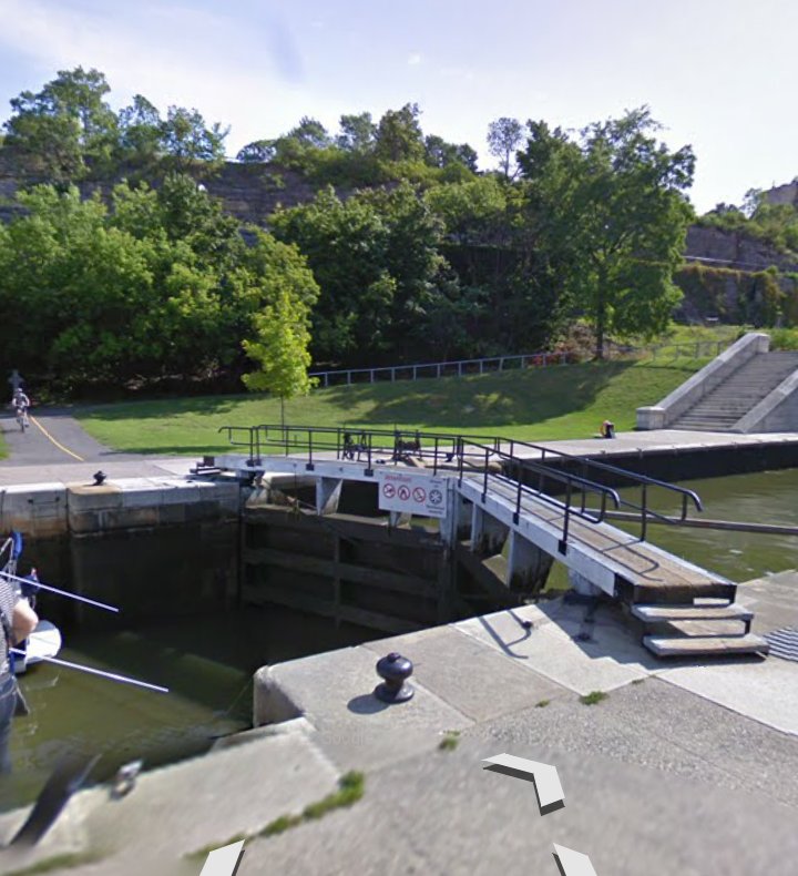 Our trip ended abruptly at the Rideau Canal locks. The map and Google's directions said to cross the canal at this bridge, marked as a "bicycle-friendly road" on Google's cycling map. I had scoped it out on a previous visit and thought maybe I could get the trailer across.