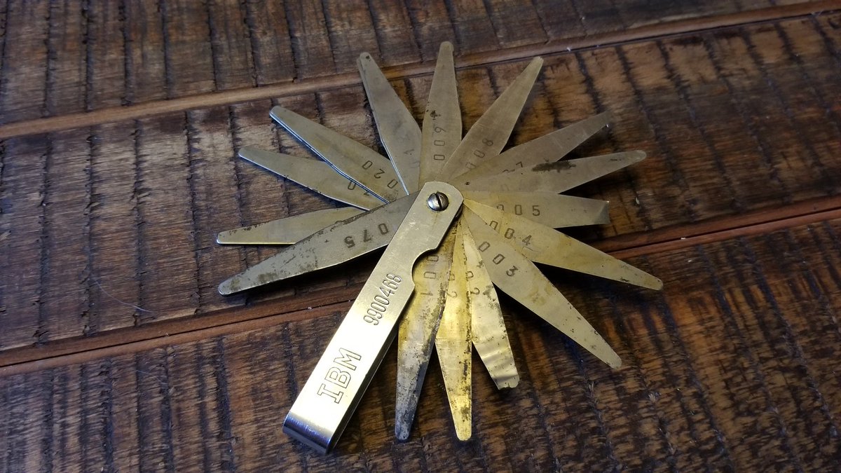 Well I'm going through his toolbox, and what do I find? An IBM branded feeler gauge, but not just ANY IBM feeler gauge, HIS feeler gauge. It's pretty worn out and a few of the blades are broken, but it's still usable, and I intend to use it when needed