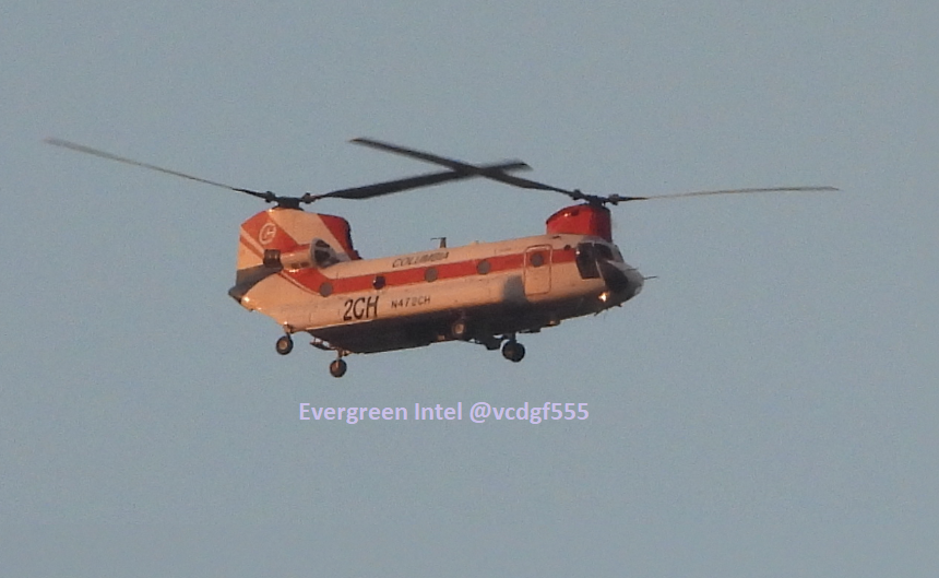 Part of the helicopter flights tonight from the Cameron Peak Wildfire. Columbia Helicopters Inc CH-47D N472CH (A5C8C2) is painted in orange light by the smoke-tinted sunset. It flew from Christman Field in NW Fort Collins to the airfield in Greeley.