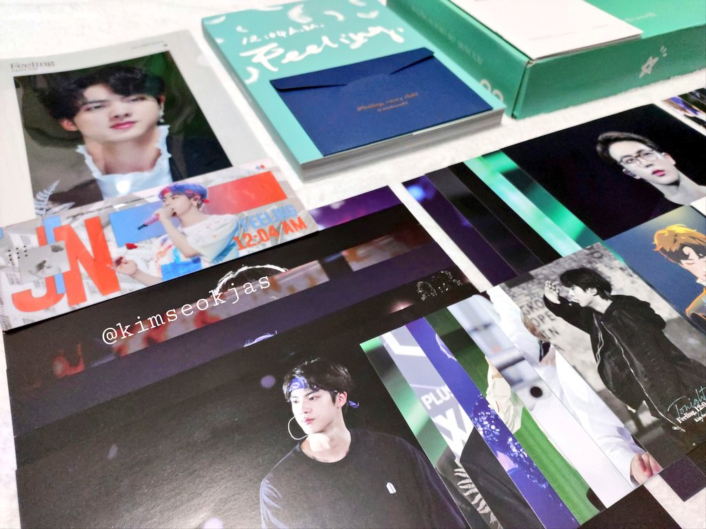  What's included  Package box () 200p+ Photobook with (with dust jacket!) Point book Ticket holder A4 Folder A4 Portrait posters (6) A4 Landscape posters (6) Large photocard set (7) 3 Small photocard set (10 ea) Envelope 2 Fanart postcard