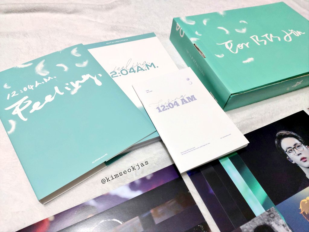  What's included  Package box () 200p+ Photobook with (with dust jacket!) Point book Ticket holder A4 Folder A4 Portrait posters (6) A4 Landscape posters (6) Large photocard set (7) 3 Small photocard set (10 ea) Envelope 2 Fanart postcard
