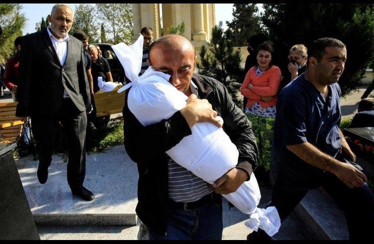 It's the result of Armenia's terror acts committed deliberatly yesterday on Ganja where's located so far from frontline. Tural Xaligov carries his 10-months-old-daughter Narın killed yesterday, death body founded under the debris.
#PrayForGanja 
#OpenYourEyes #GanjaCity