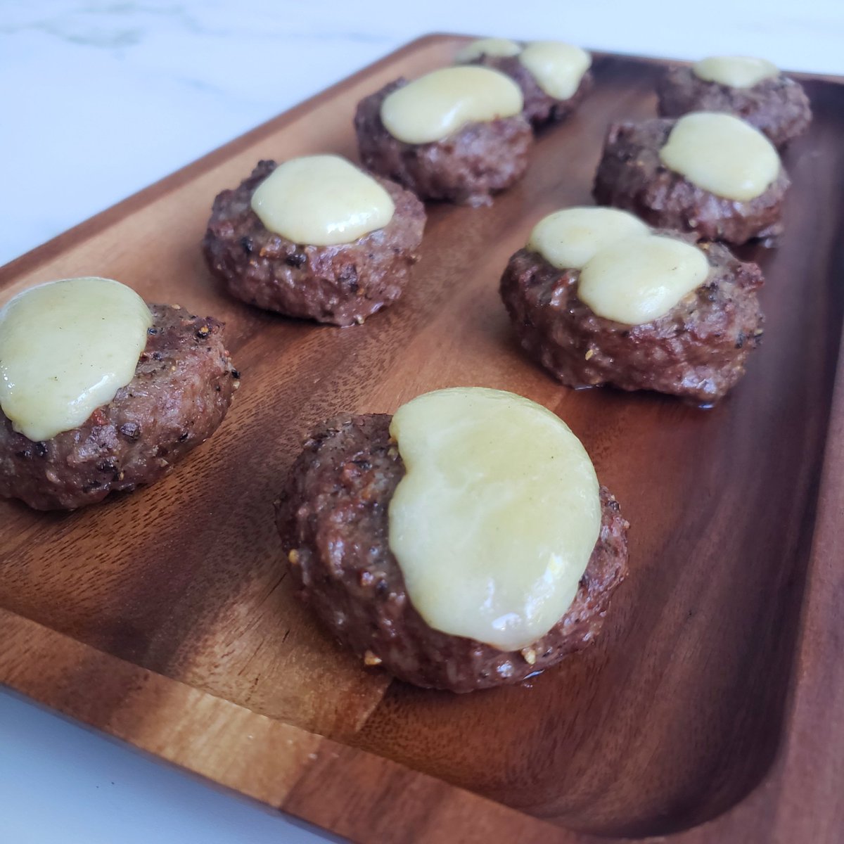 Baby burgers with lil cheddar cheese curds melted on top for game day! 🤤 #GoDawgs

The patties are ground chuck slider burgers from <a href="/Publix/">Publix</a> and the cheese curds (which we are OBSESSED with microwaving for a snack!) are from <a href="/AldiUSA/">ALDI USA</a>. Made on the <a href="/TraegerGrills/">Traeger Grills</a> 💯 #keto