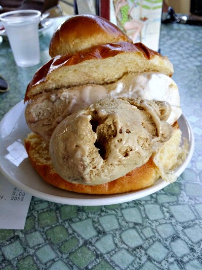 The most sinful combo is a brioche sandwich filled with whipped cream and gelato. With a dessert like this, things are just *bound* to get messy. But it's worth it. At least, that's what you tell your sore jaw after the deed. 11/