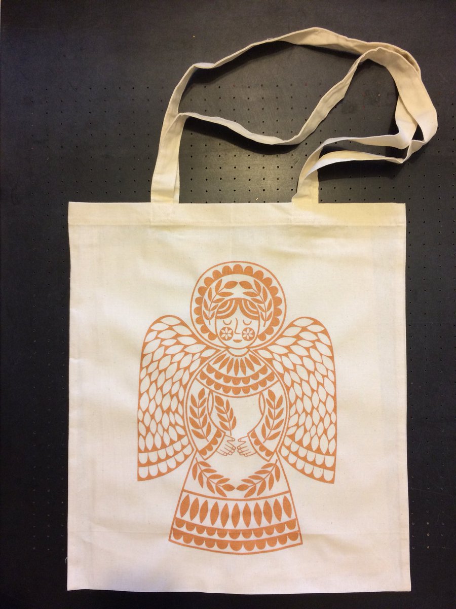 KarolineRerrie's tweet photo. It’s all about #angels at the moment! Getting new work ready for #christmasexhibitions. #screenprinted a trial run of angel #totebags. Couldn’t decide between @Permaset gold & copper #textileinks. So I used both to make rich gold which works well on natural cotton totes https://t.co/6s2TT7GQCN