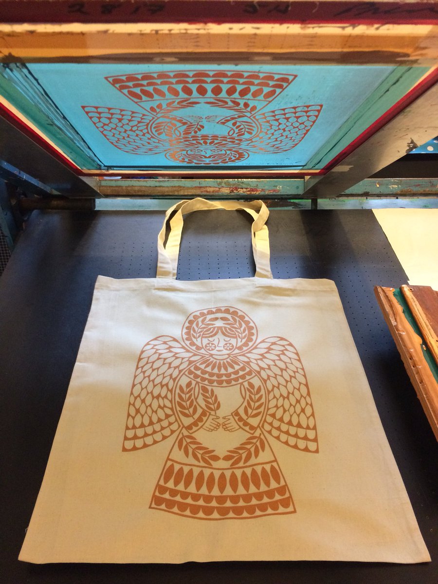 KarolineRerrie's tweet photo. It’s all about #angels at the moment! Getting new work ready for #christmasexhibitions. #screenprinted a trial run of angel #totebags. Couldn’t decide between @Permaset gold & copper #textileinks. So I used both to make rich gold which works well on natural cotton totes https://t.co/6s2TT7GQCN