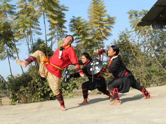 Manipur- Thang ta Dance -an incredibly beautiful martial arts form of dance by people from all walks of life in Manipur, it portrays mastery in swindling sharp metallic swords , daggers to wooden spears while flying graceful in a swift motion