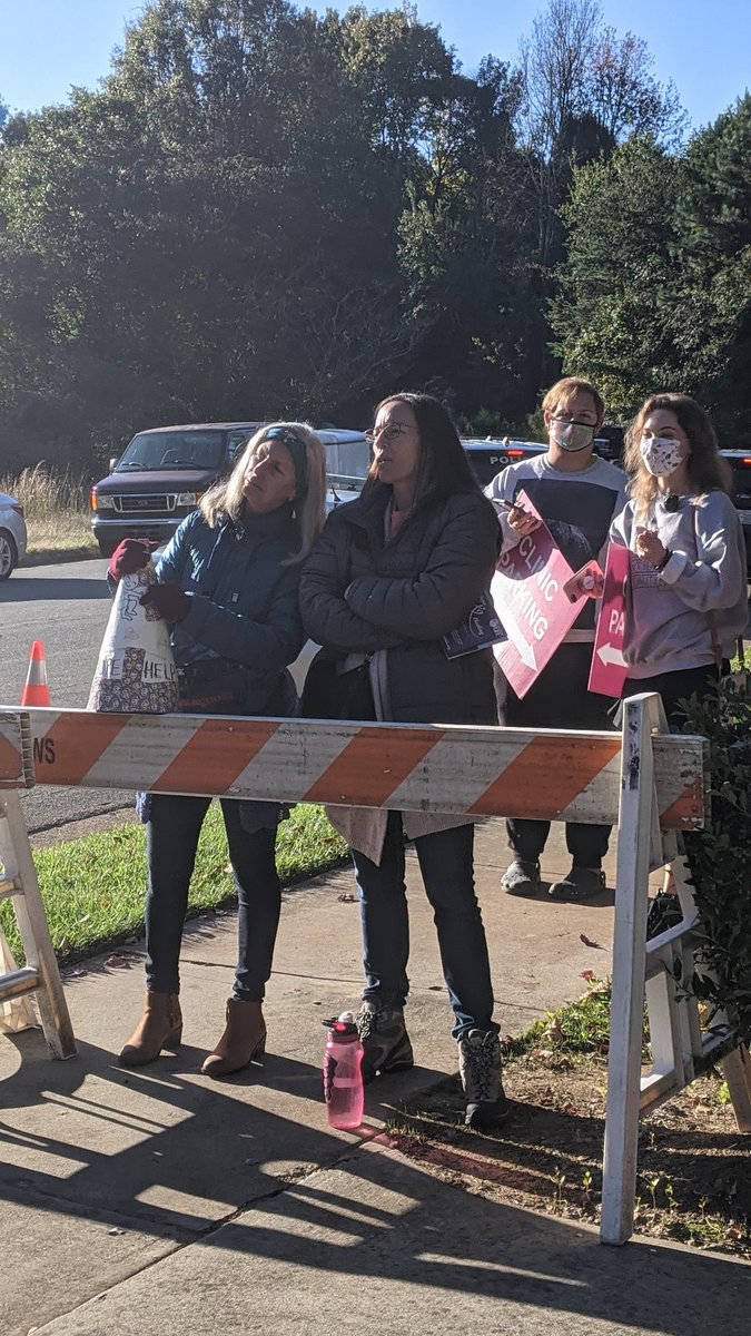 Two  @lovelifeclt Antis trying to determine the best angle to yell at patients after we were able to claim the zone in front of the parking lot for a change.