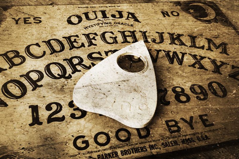 The ouija (also known as a spirit board or talking board) is a flat board marked with the letters of the alphabet, the numbers 0–9, the words "yes", "no", occasionally "hello" and "goodbye", along with various symbols and graphics.