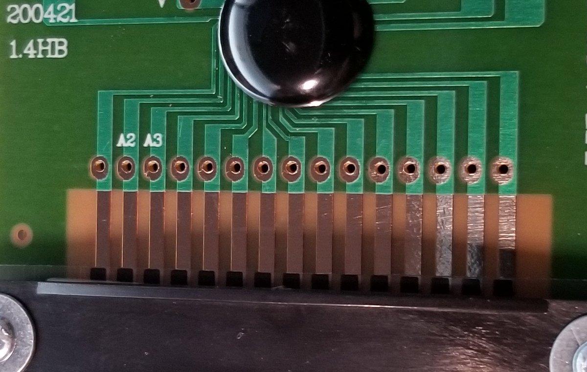 So while attaching to those flex connectors is annoying, this board actually makes it potentially really easy for me.See those holes above the contacts? I could just solder on a header there, and attach to that.