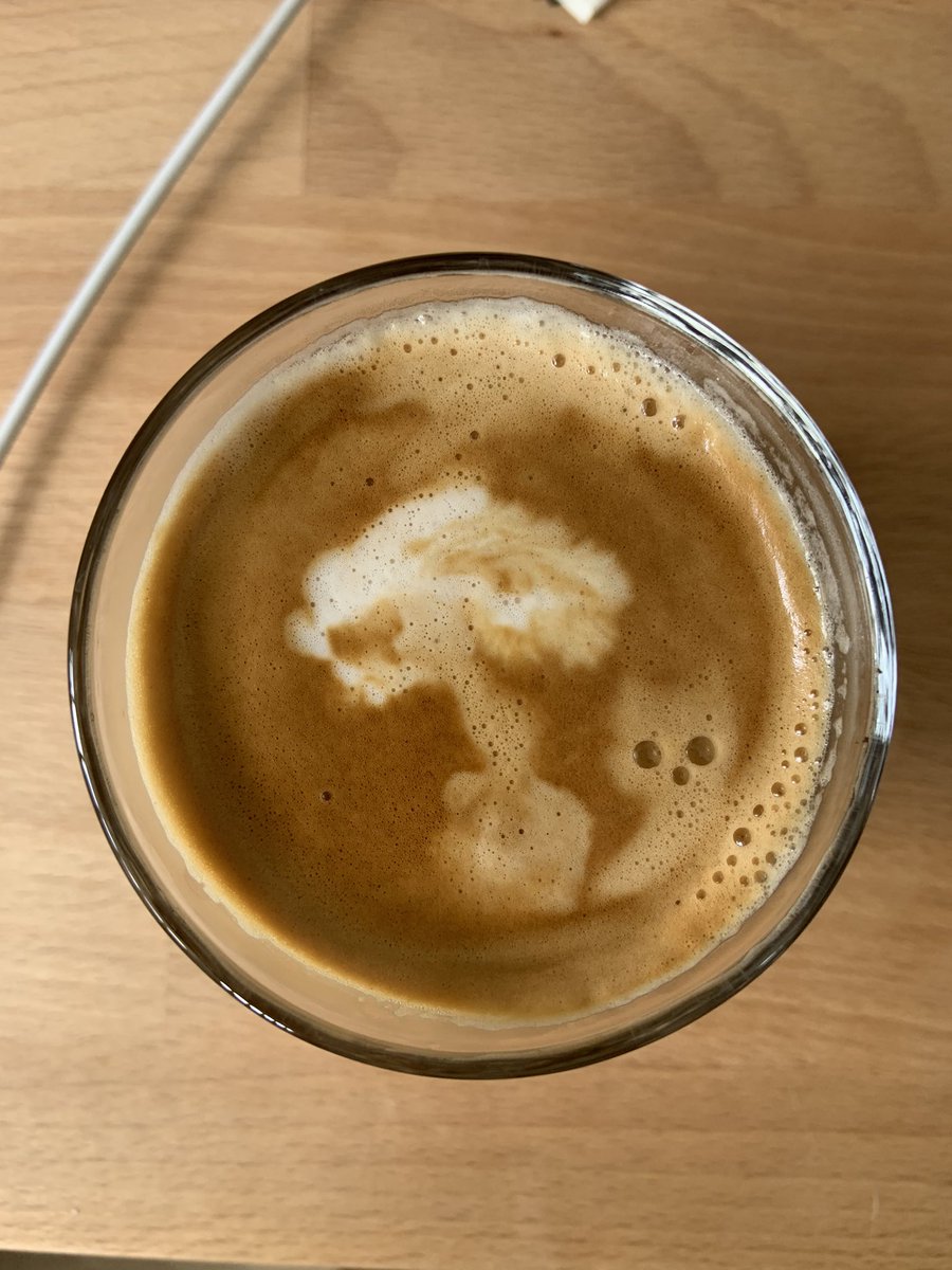 martyps's tweet image. My coffee art today is a cat letting off an atomic bomb