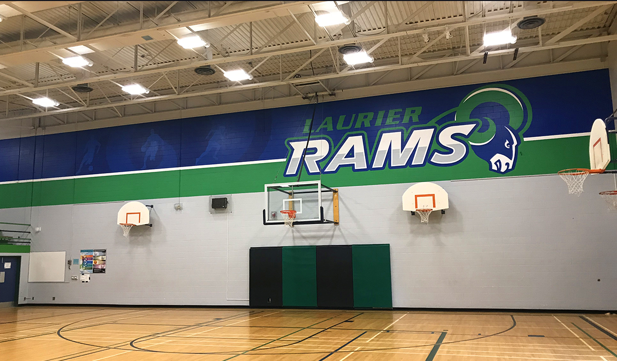 muralworks's tweet photo. It was time for an update! What a transformation! Thank you @LaurierSS for the opportunity! #schoolmural #gymmural #muralworks #rams #homeoftherams #schoolpride #graphicart #graphicmural @TVDSB @ARTSHINEINC https://t.co/kZOKlBTx4s